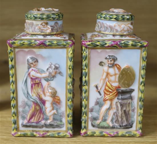 A pair of Naples porcelain canisters